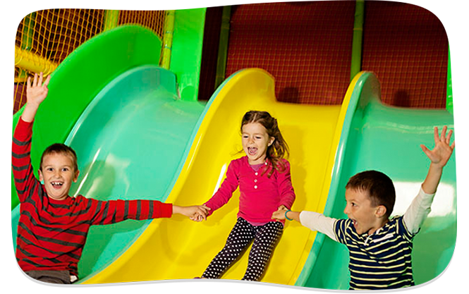 Children on slide at indoor playground